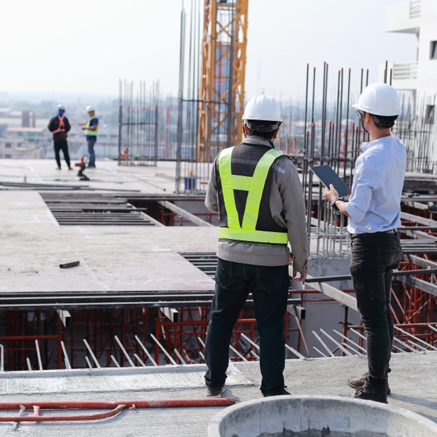 A construction crew examines a project.