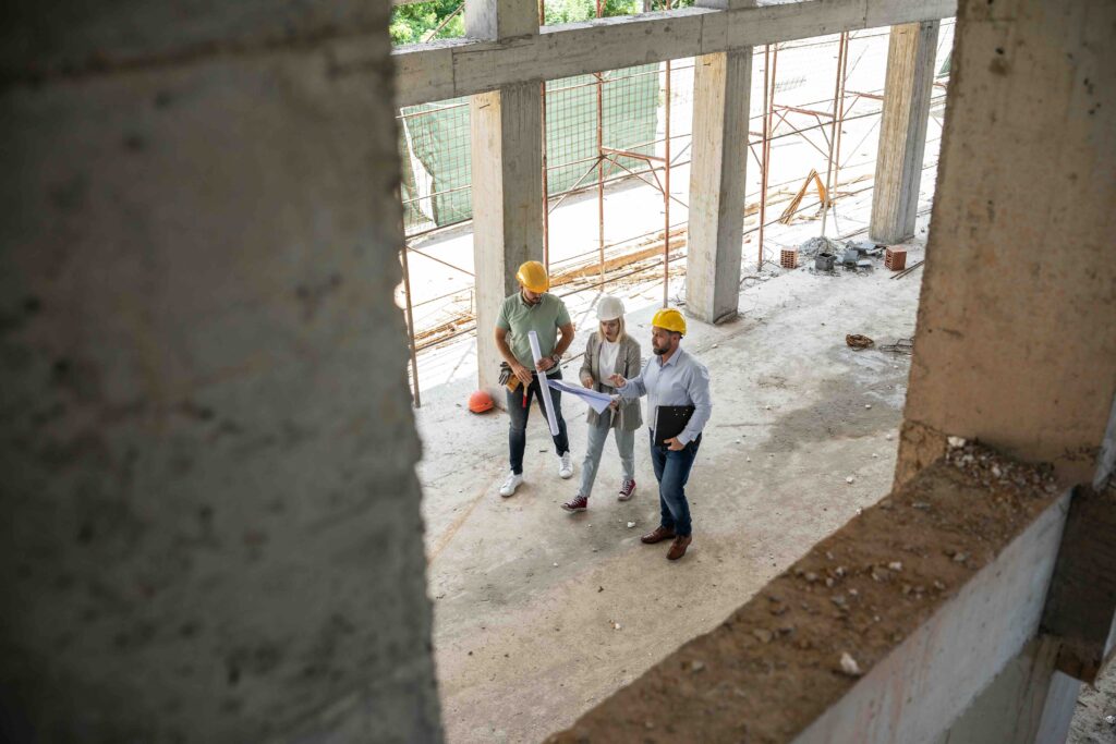 a female architect and construction managers work