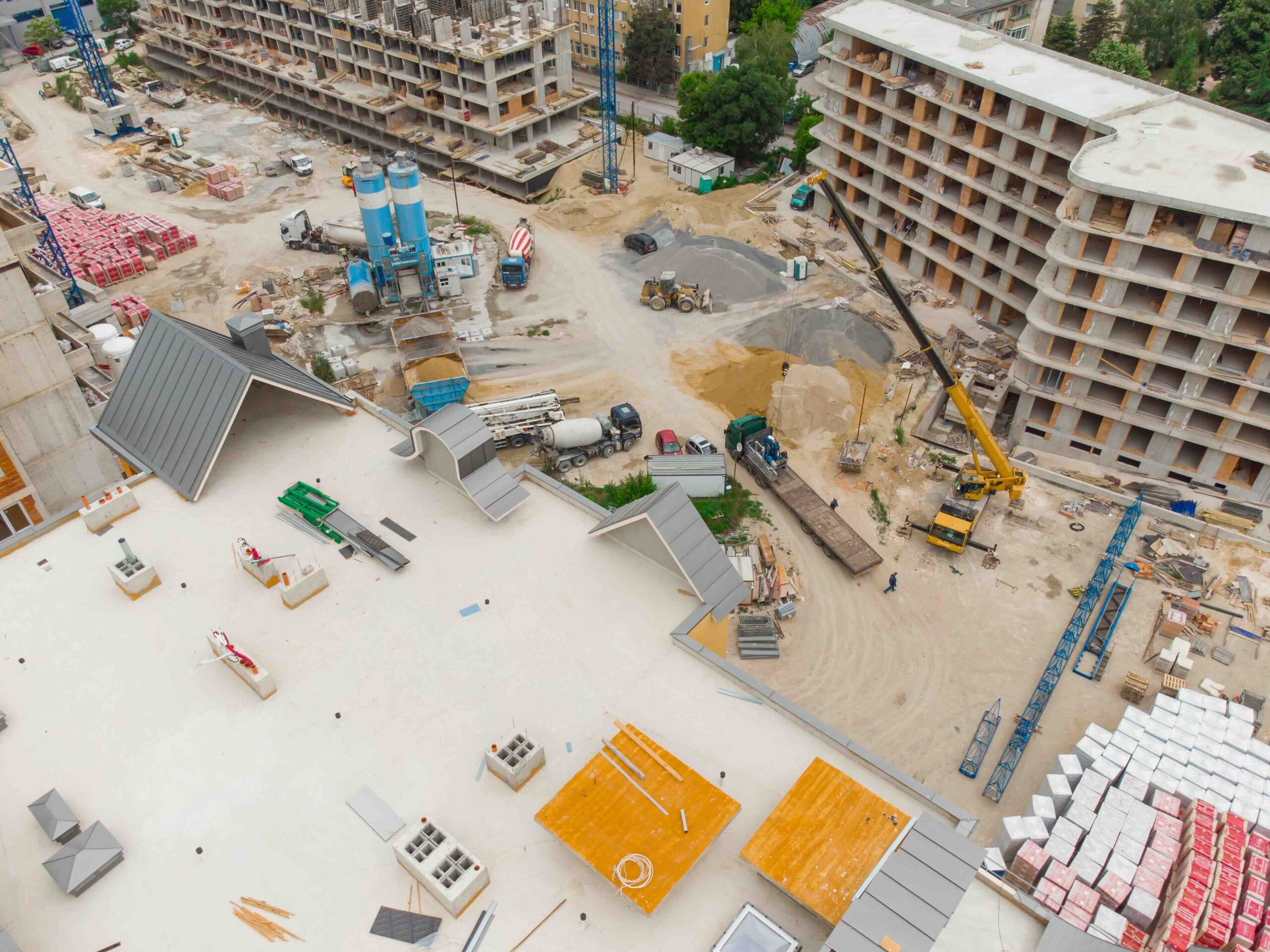 Busy Construction Site and Construction Equipment Aerial top view