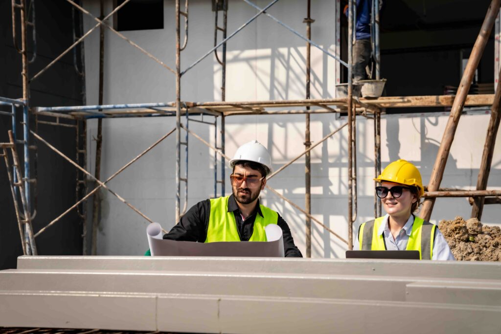 Engineer technician inspects building structure Engineer technicians are looking at and analyzing unfinished construction projects. In order to be in accordance with the design