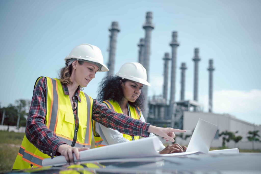 Engineers wearing safety gear including hard hats