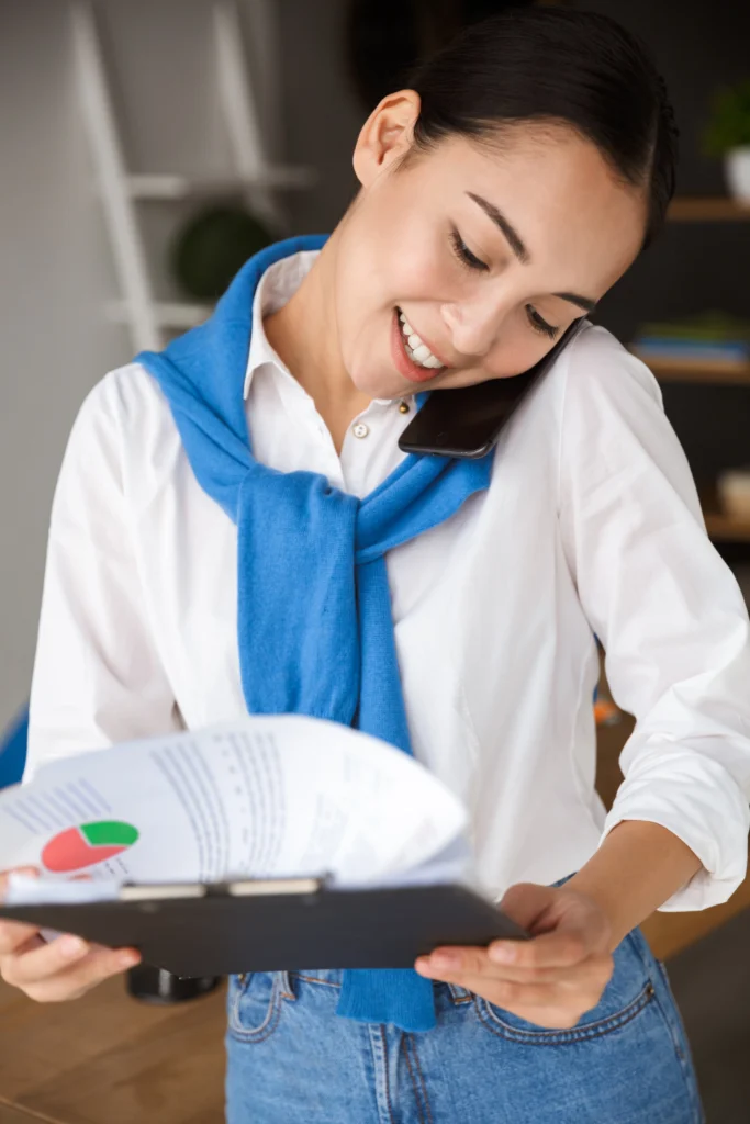 image of young asian woman talking on cellphone