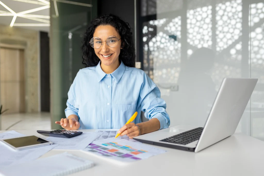 portrait of young-successful financier at workplace