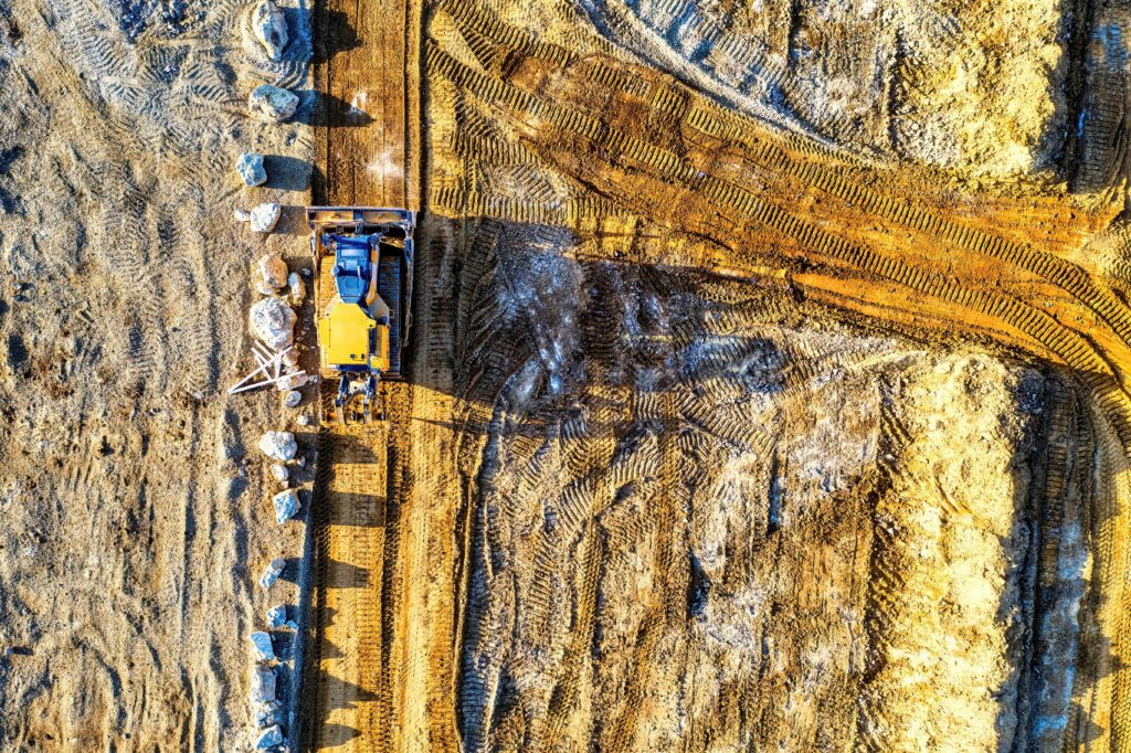 A top down view of heavy machinery working on a construction project in California