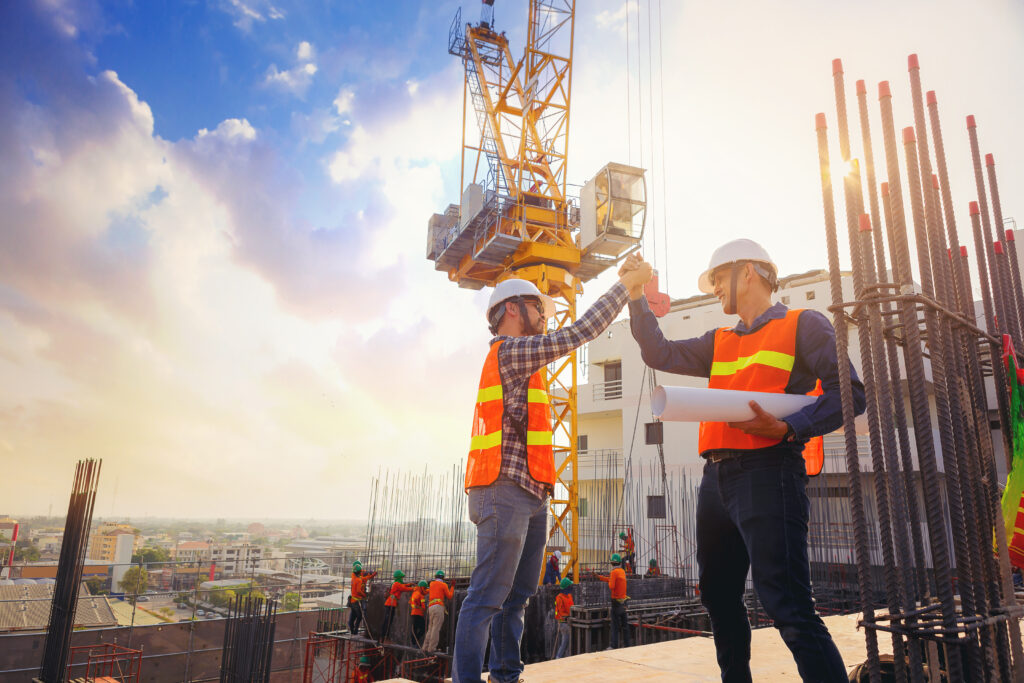 Two constrcution workers working together on a construction site