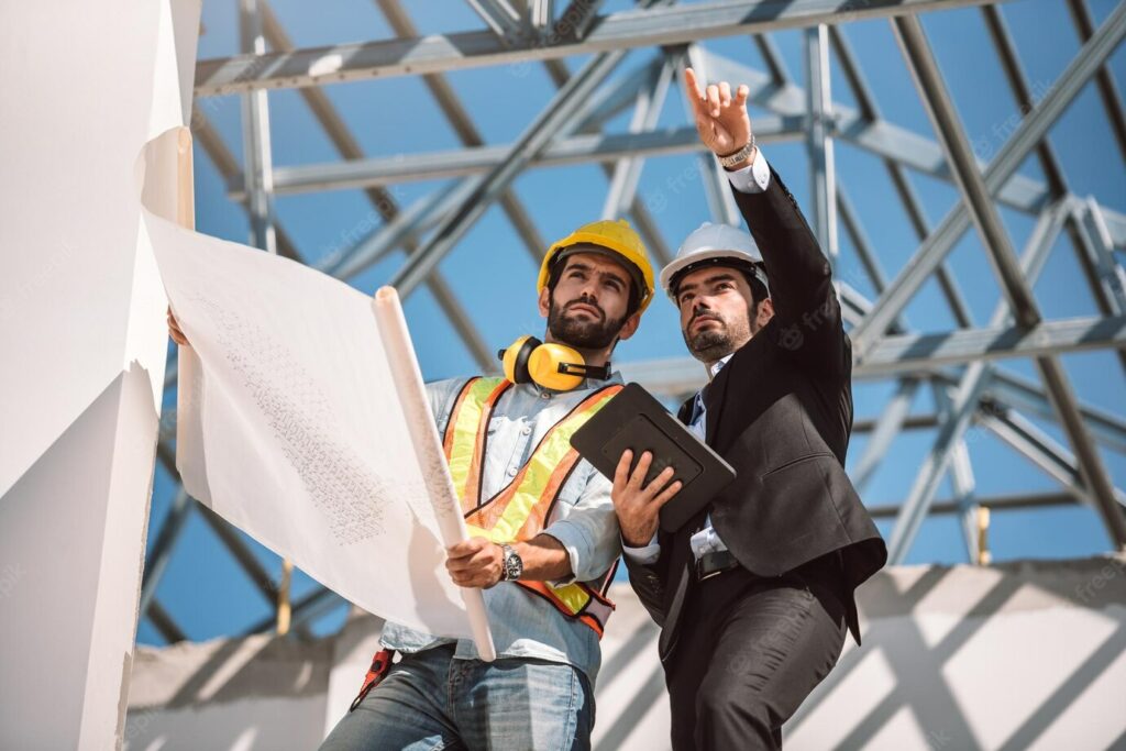 two engineers on a construction site collaborating and communicating with each other