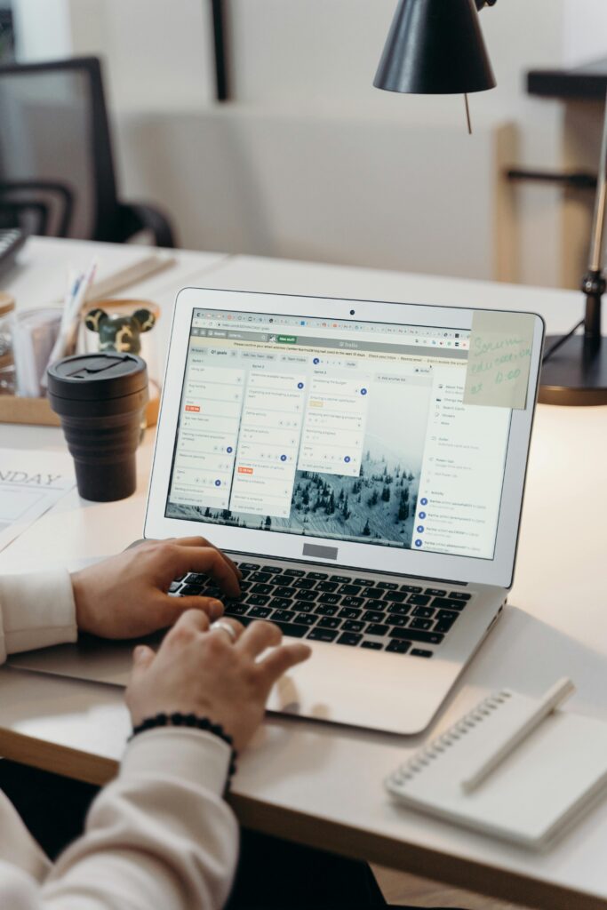 A worker using a team collaboration tool on their laptop