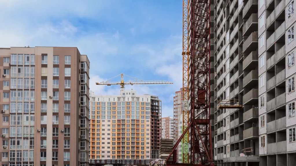 High-rise buildings under construction with crane view