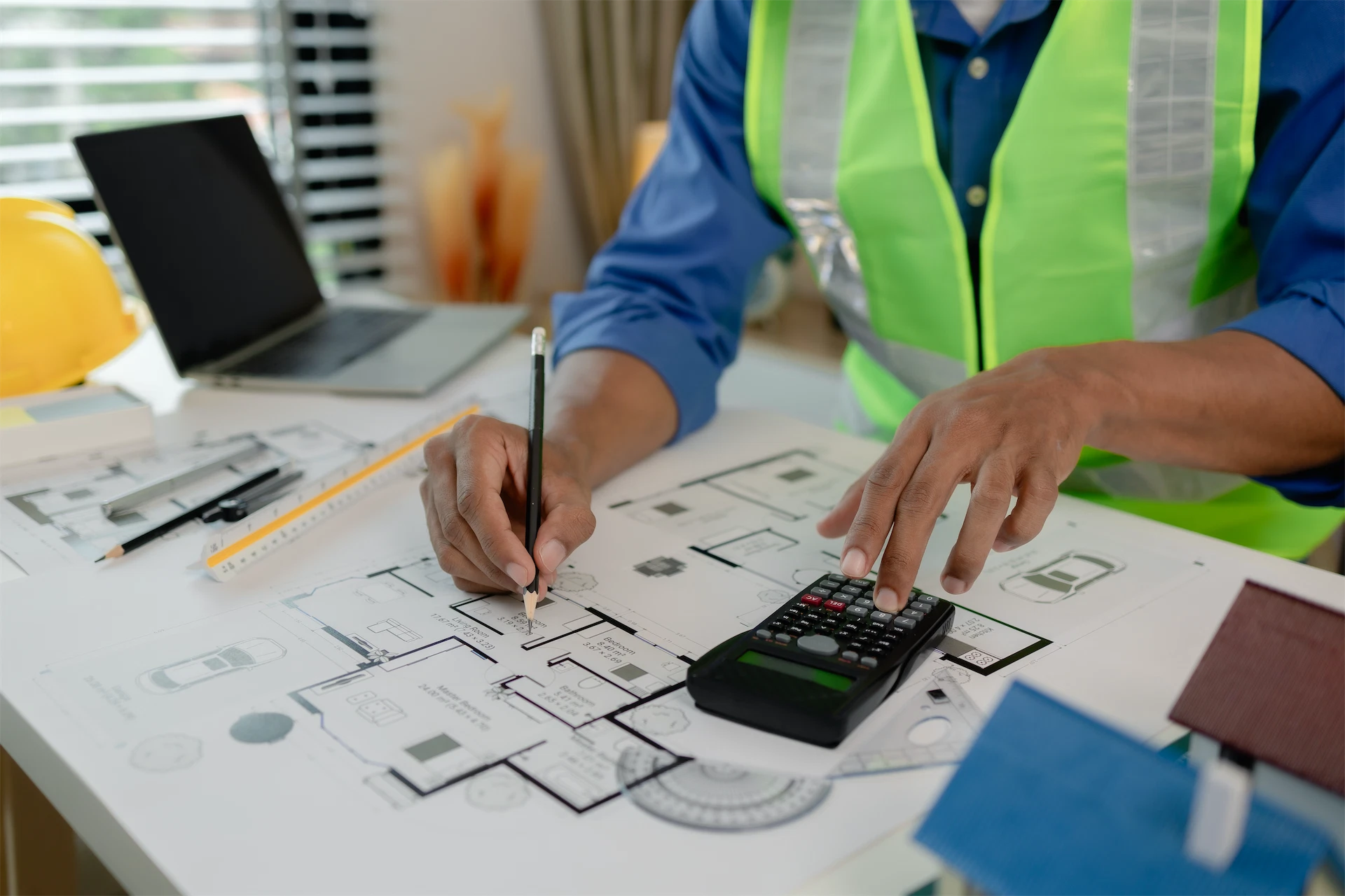 Construction estimator virtual assistant checking blueprints