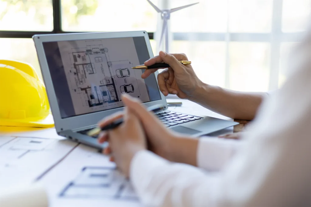 CAD virtual assistant discussing house floor plan displayed on laptop screen